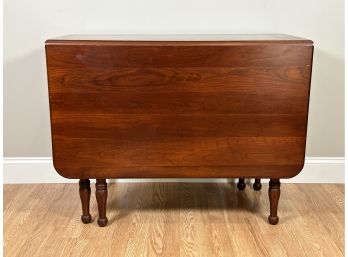 A Vintage Drop-Leaf Gateleg Table In Cherry