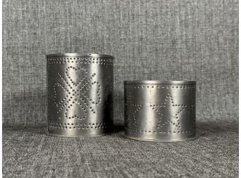 A Pair Of Vintage Punched Tin Candle Holders