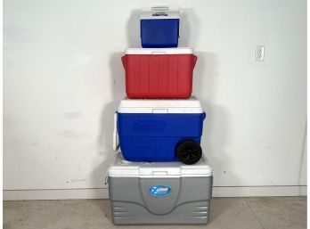 A Stack Of Coolers In Varying Sizes