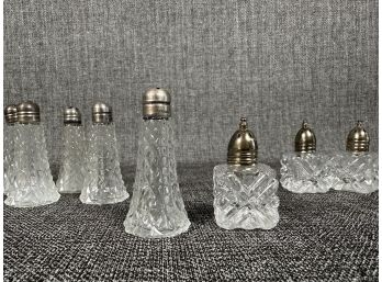 An Assortment Of Individual Salt & Pepper Sets In Cut Crystal