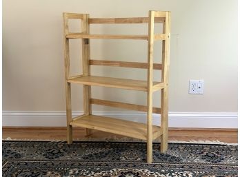 A Folding Bookcase In Blonde Wood