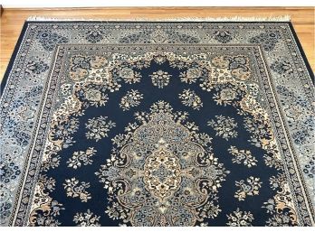 A Traditional Area Rug In Blue Tones, 7.75' X 11.3'