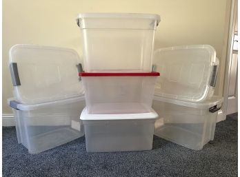 An Assortment Of Plastic Storage Tubs With Lids