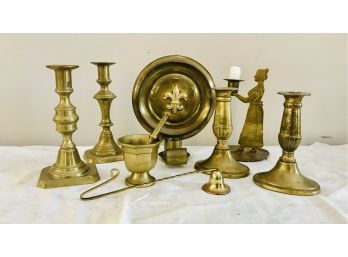 Eight Brass Candle Holders & A Mortar And Pestle
