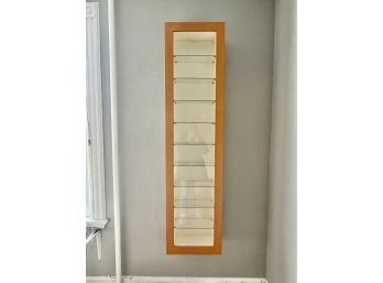 A Modern Hanging Cabinet With Glass Shelves