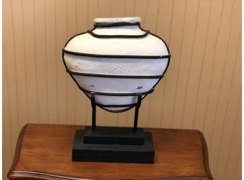 Clay Vase On Iron Stand