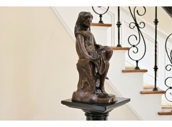 Bronze Statue Of A Contemplative Lady Sitting On Stump