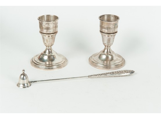 Pair Of Cartier Weighted Sterling Silver Candlesticks
