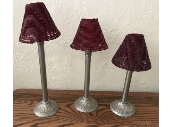 Three Candle Sticks With Red Beaded Shades