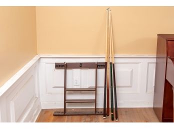 Four Pool Sticks And Wall Holder