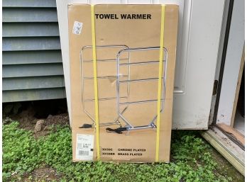 A Brass-Plated Towel Warmer By Loromar Company