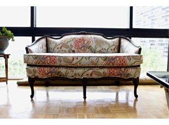 Finely Upholstered Floral Sette With Carved Wood Embellishments And Cabriole Legs