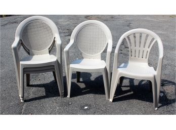 Five Beige Plastic Stacking Outdoor Lawn Chairs