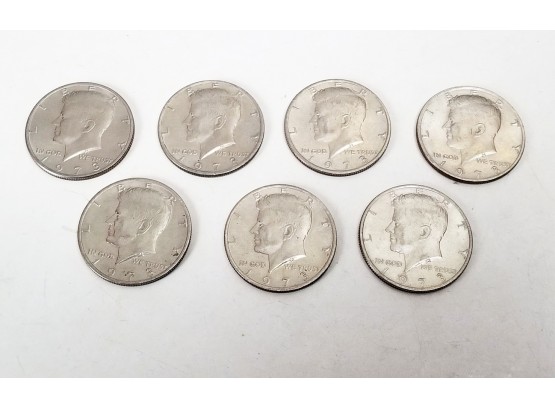 7 1973 Kennedy Half Dollar