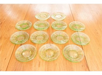 Thirteen Green Depression Glass Saucers