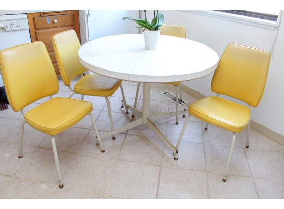 White Round Kitchen Table With Leaf Extension And Four Yellow Chairs