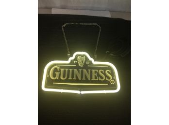 Fluorescent Guinness Light With Hanging Chain And Switch On The Wire