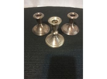 Three Sterling Silver Candle Holders One Is Larger Than The Other Pair