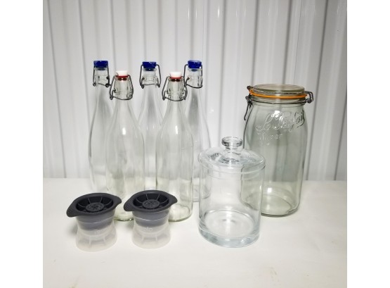 Glass Bottles, Storage Canisters, & Pair Of Tevolo Silicone Juice Extractors