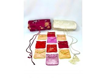 Pair Of Eastern-inspired Clutches With Collection Of Buttoned Pouches