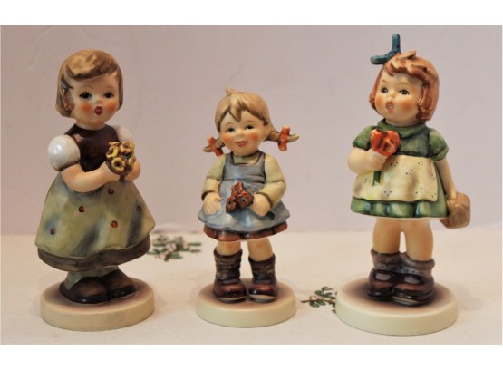 Three Hummel Figurines #548 Flower Girl, #431 The Surprise, #257 For Mother