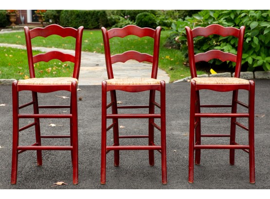 Set Of Three Painted Red Wooden Stools With Rush Seats