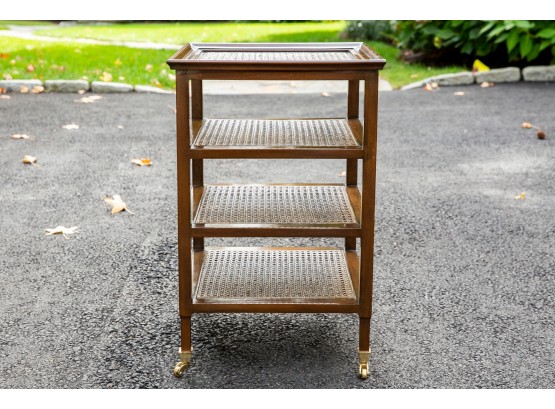 Four Tier Cane Table With Glass Top On Brass Casters