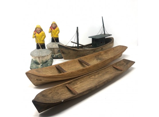 Pair Of Molded Metal Fisherman Bookends With Three Wooden Boat Carvings