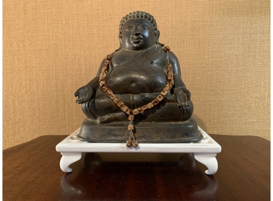 Metal Buddha With Prayer Beads On Porcelain Stand