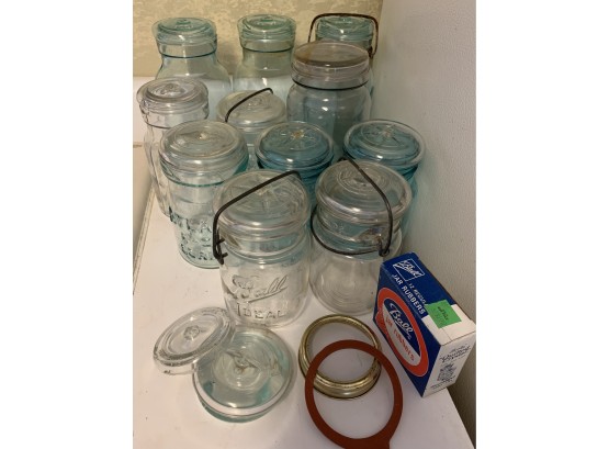 Clear And Blue Canning Jars Of Various Sizes