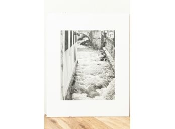 Black & White Photograph Of A Flooding Canal