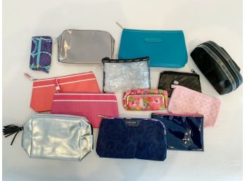 A Colorful Group Of Make Up Bags