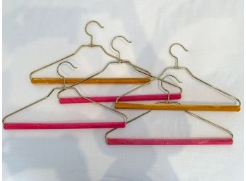 A Group Of Five Heavy Hangers With Velvet
