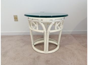A Circular Bamboo And Rattan Glass Top Accent Table
