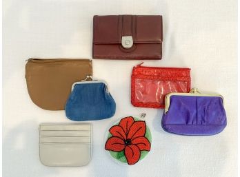 A Group Of Credit Card Holders And Change Purses