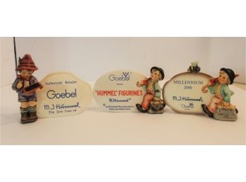 Three Assorted Hummel Retailers Store Display Sign Figurines
