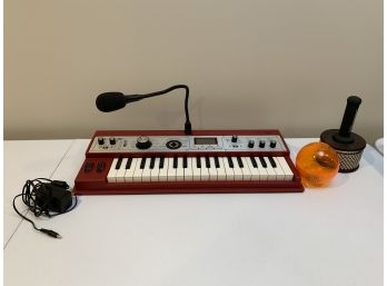 KORG Keyboard With Mic Model: MKXL And Two Percussion Instruments