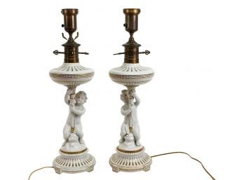 Pair Of Signed 'RPM' Porcelain Gilt Putto Lamps With Fluted Circular Base