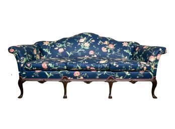 Three Cushion Upholstered Navy Blue Floral Couch With Carved Wood Frame