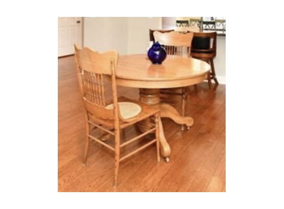 Round Oak Table With Three Pressed Back Cane Bottom Chairs