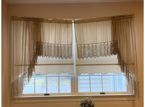 Cream Sheer Curtians Panels With Beaded Swag Fringe Decoration.