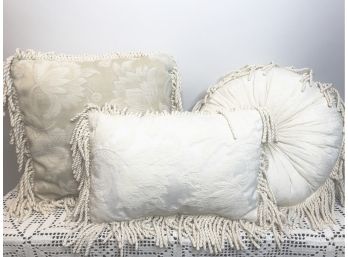 Three Ivory Fringed Throw Pillows