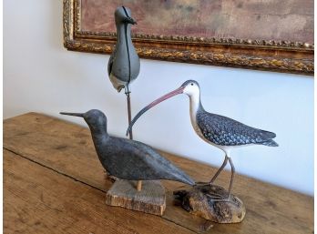 Two Wood And One Tin Decoy On Driftwood