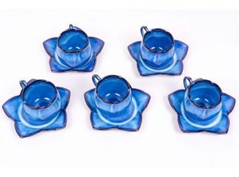 Set Of Five Blue Pottery Teacups With Flower Shaped Saucers