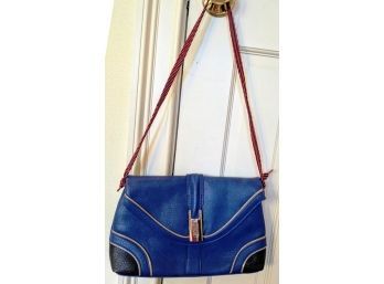 Blue Leather Bag With Whimsical Bag Handle And Fun Piping