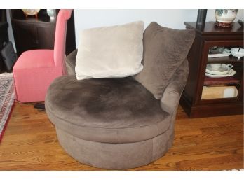 Large Over Sized Swivel Chair Made By The Ashley Furniture Company With Two Over Sized Throw Pillows