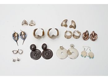 Eleven Pairs Of Silvertone Pierced Earrings