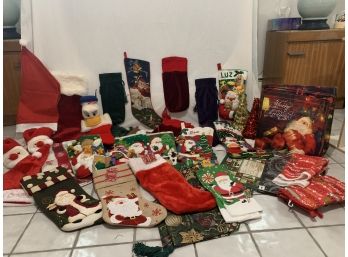Large Collection Of Christmas Stockings, Table Cloths, Christmas Mitts, Slippers