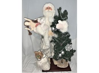 Santa Dressed In White Suit With Christmas Tree