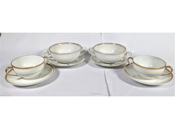 Set Of 4 Cream Soup And Saucer Pieces Of Fine China With A Gold Trim And Simple Design